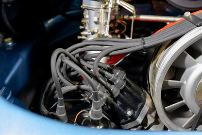 Close-up of an engine with spark plugs and wiring