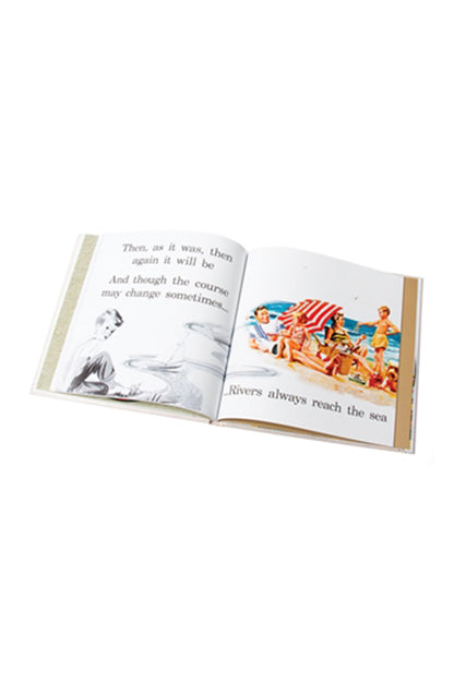Open book with a beach scene illustration on a white background
