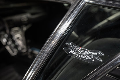 Close-up of a car's interior with a decorative emblem on the dashboard.