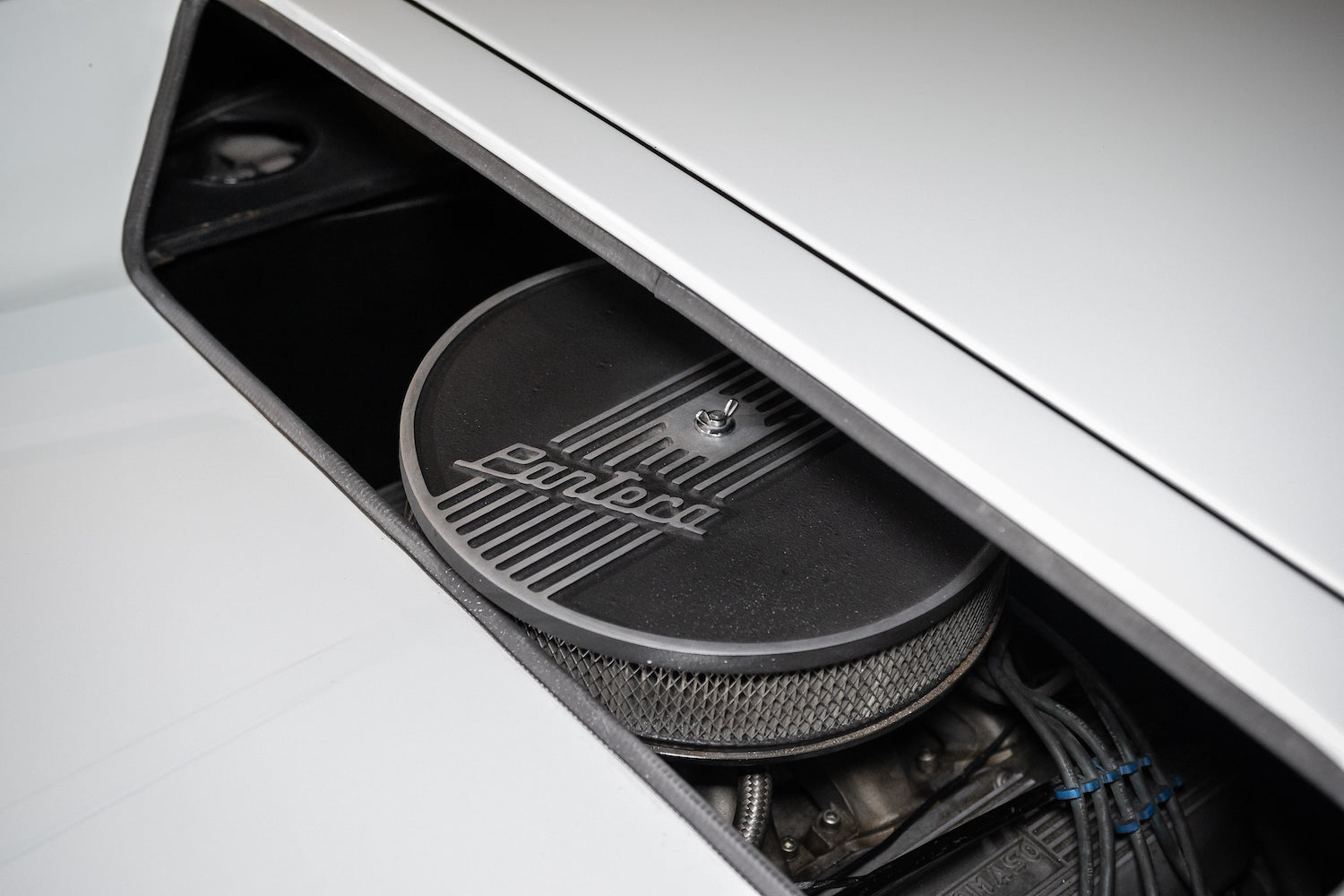Close-up of a car's audio system with 'Ford' branding on a white background
