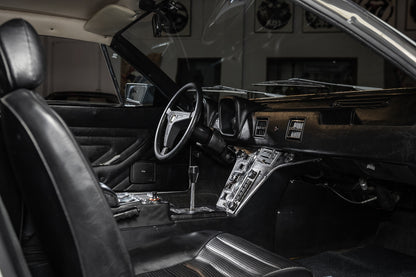 Vintage car interior with steering wheel and dashboard