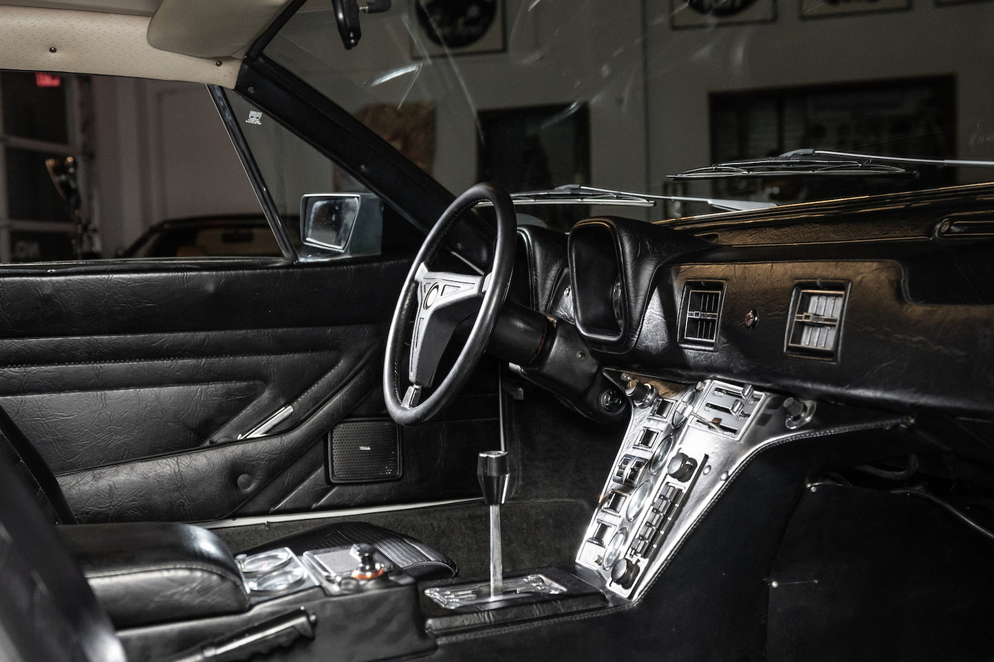 Vintage car interior with steering wheel and dashboard
