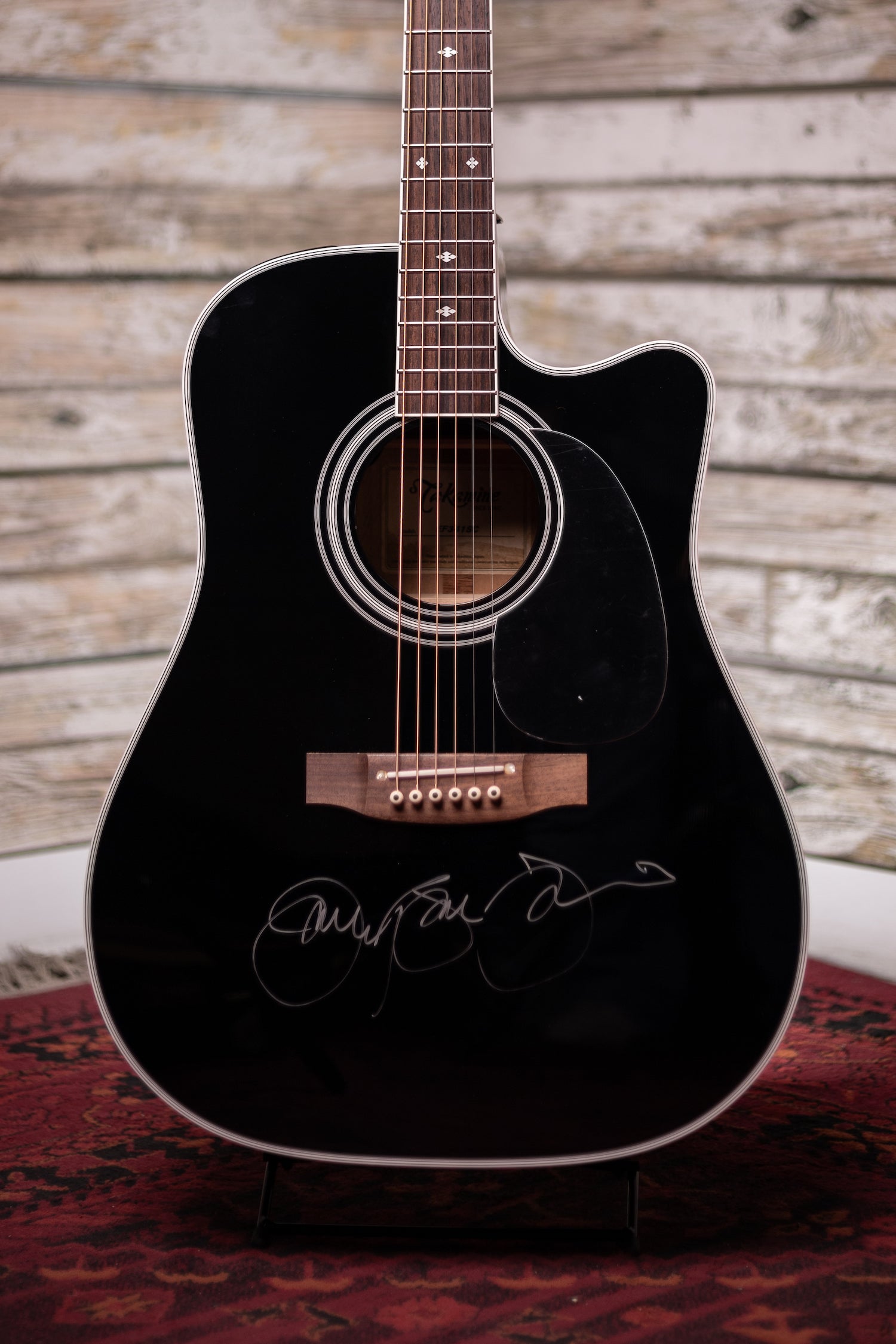 black fender acoustic guitar