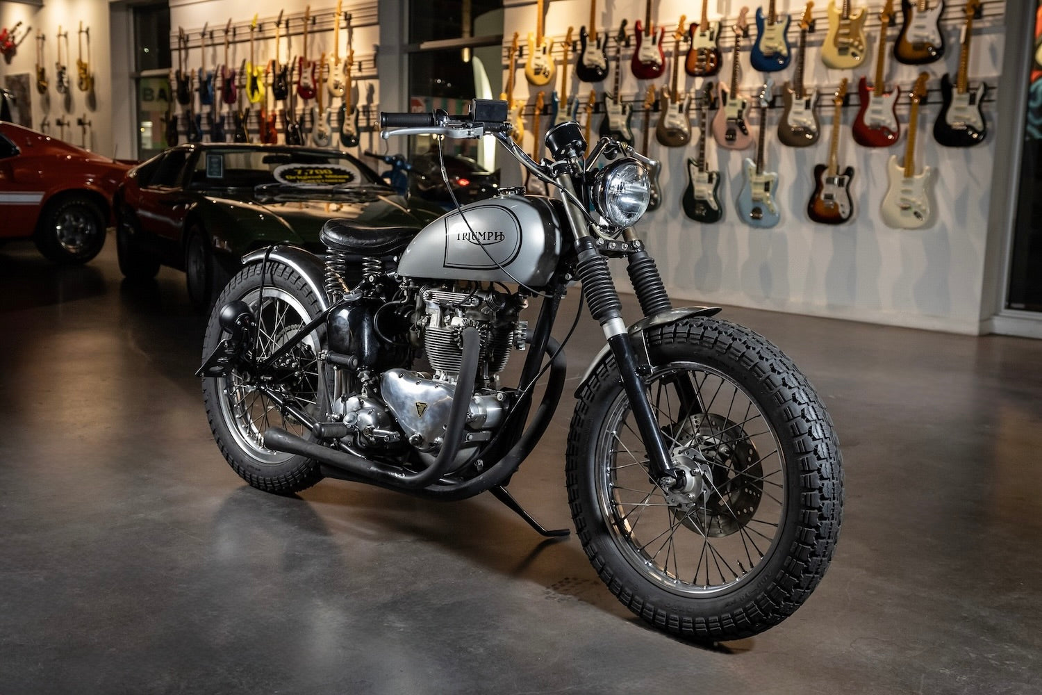 Motorcycle in a showroom with guitars on the wall