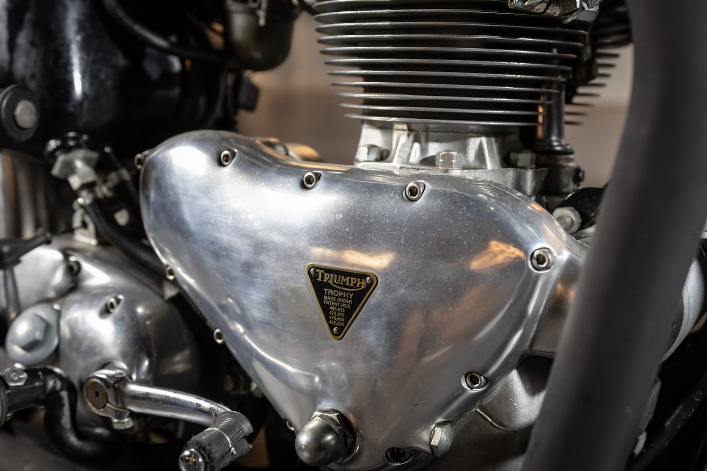Close-up of a Triumph motorcycle engine with visible branding.