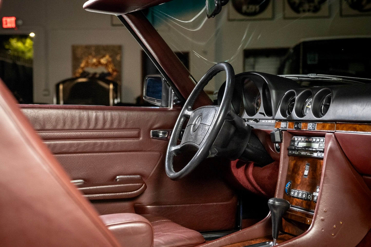 Close-up of a car's interior with brown leather seats and dashboard.