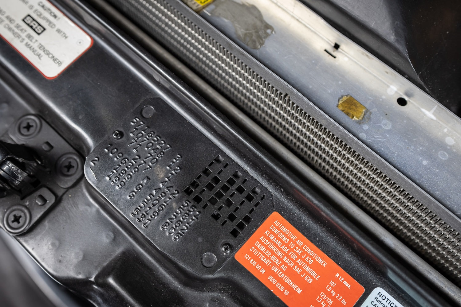 Close-up of a car's interior panel with text and labels.