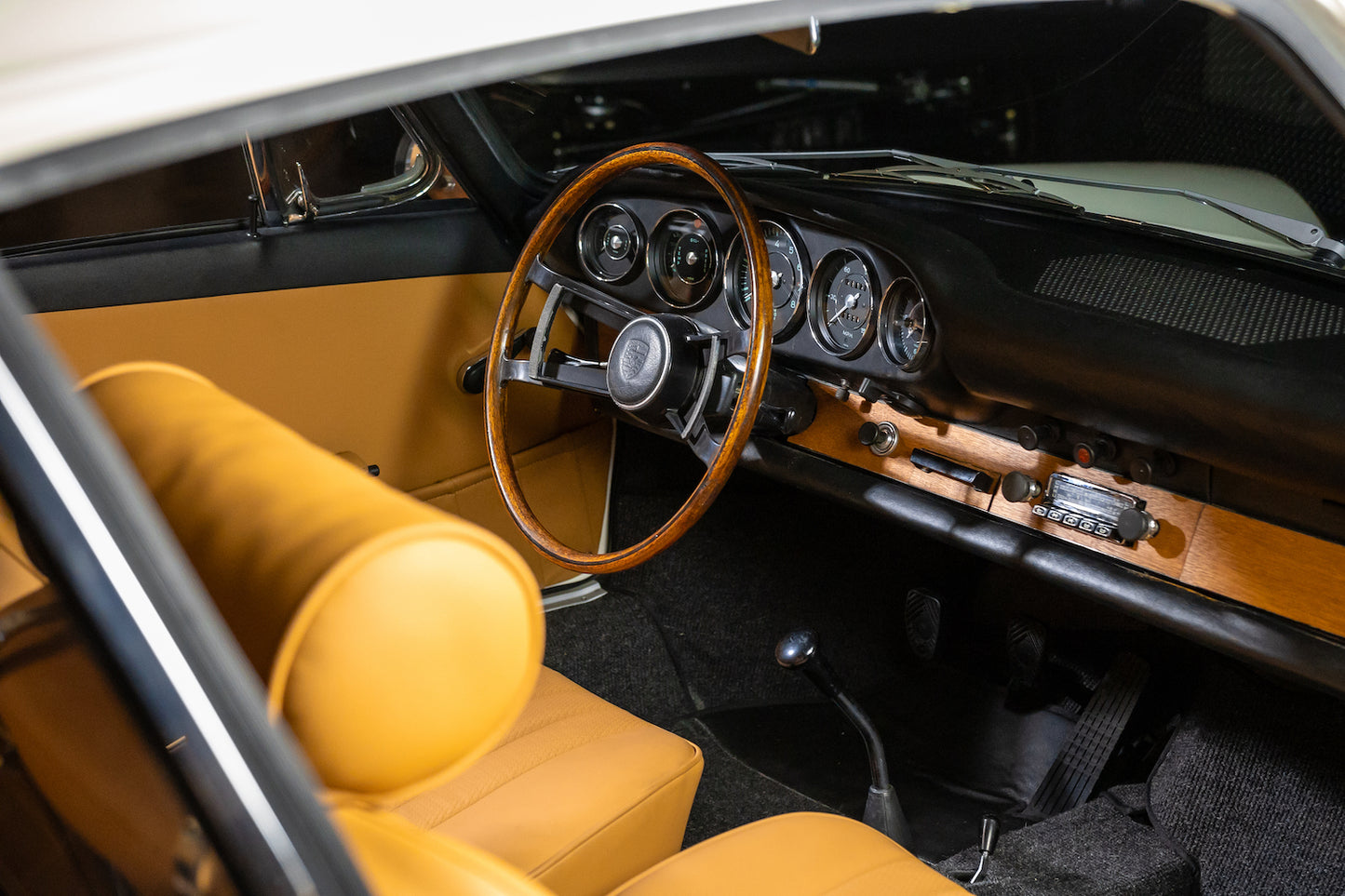 Car interior with yellow seats and wooden dashboard