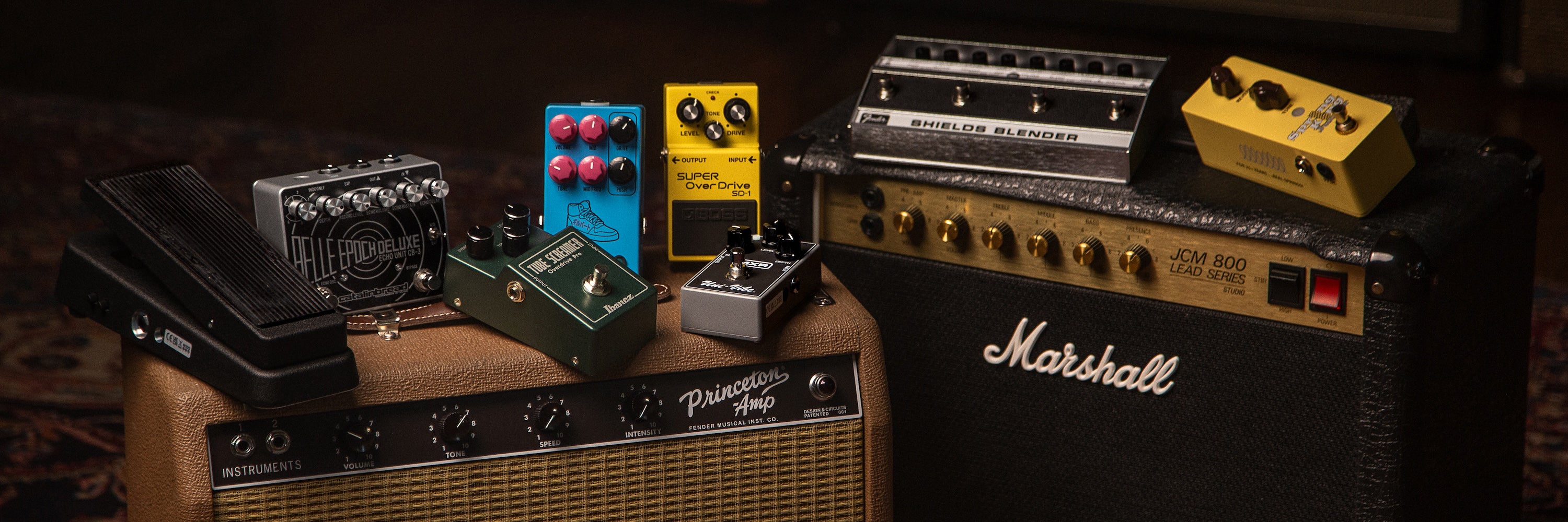 Guitar effect pedals on top of guitar amplifiers