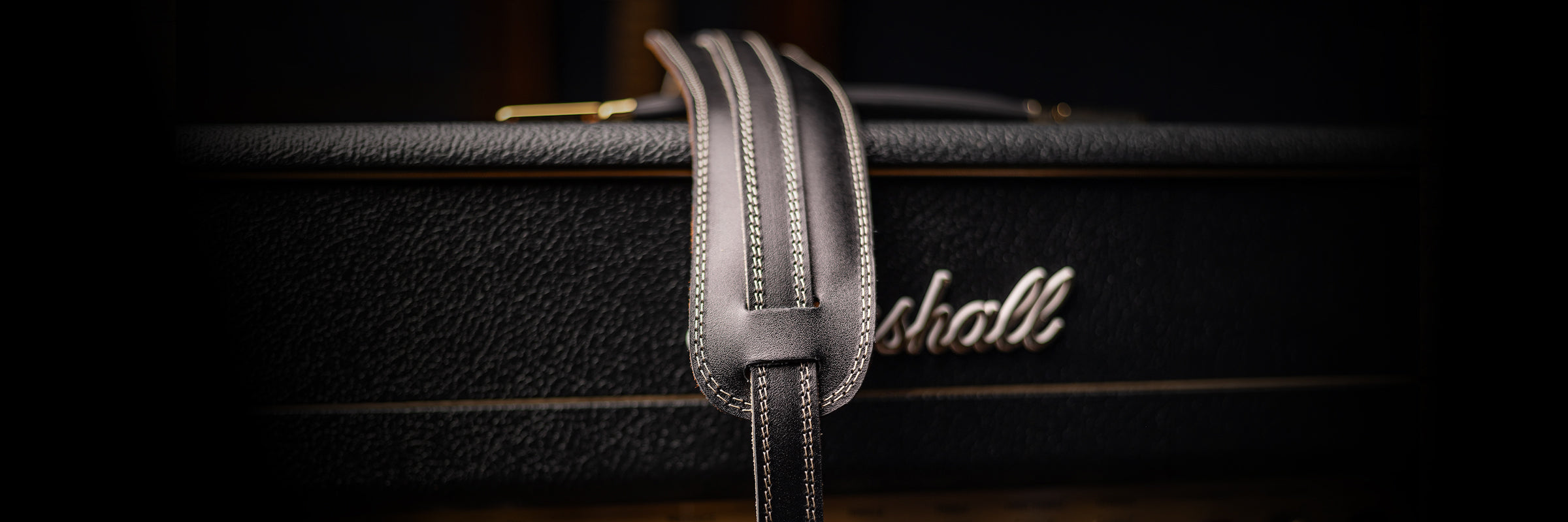 Leather Guitar Strap on top of Marshall amp