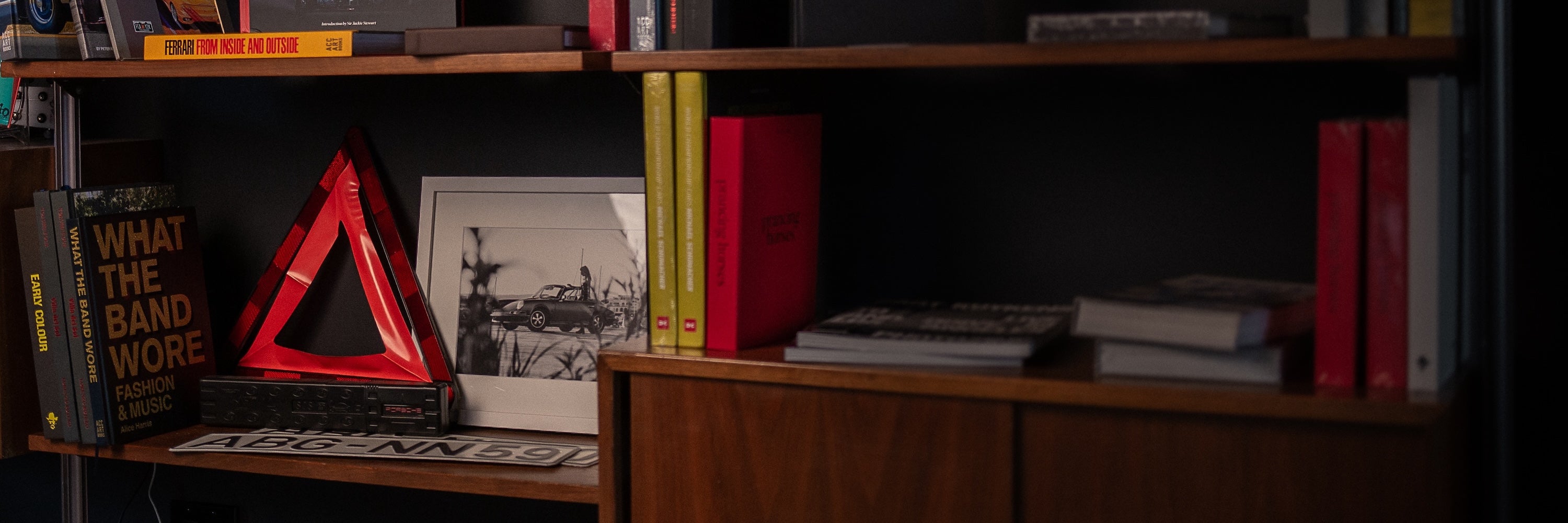 Car stuff on bookshelf