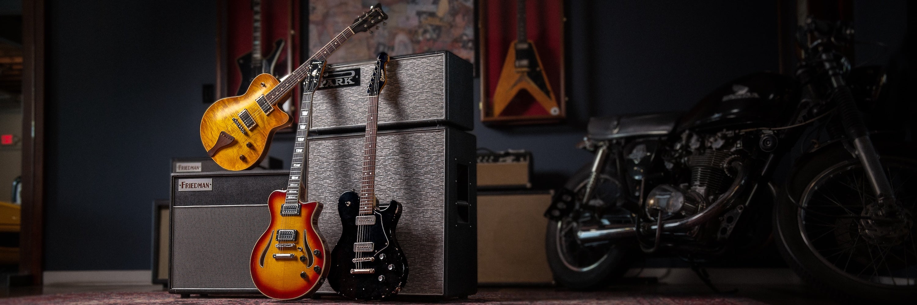 Boutique electric guitars in front amps at Walt Grace Vintage