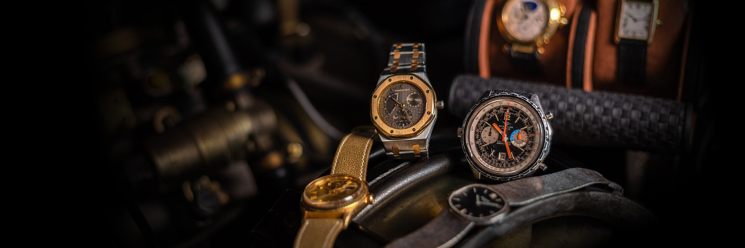 Watches on top of classic car engine